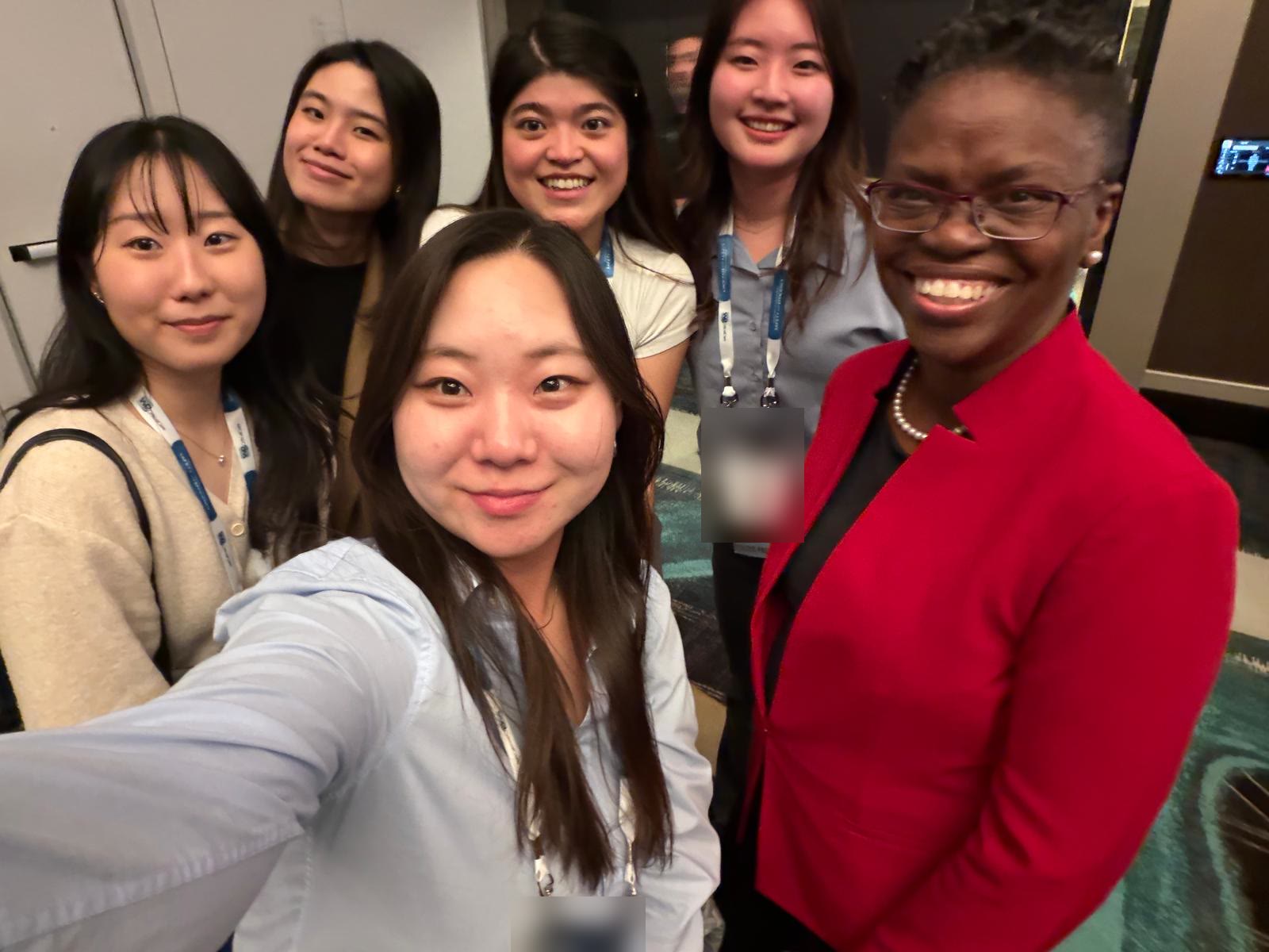 Prof. Tofade with pharmacy students at a conference